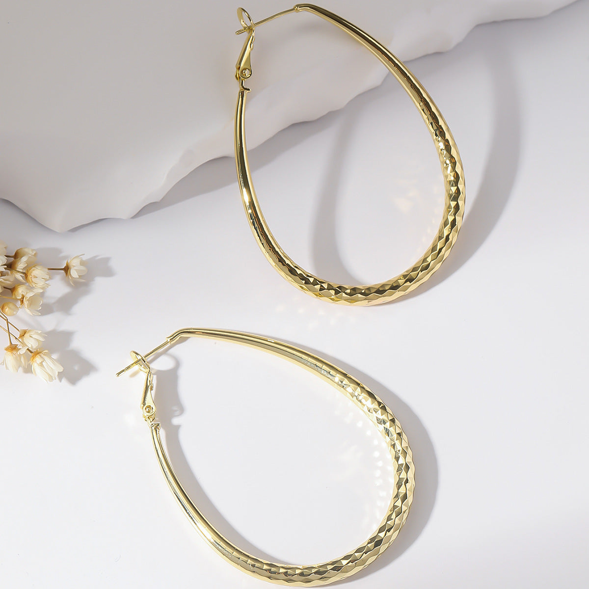 Radiant Teardrop Hoop Earrings in Polished Gold