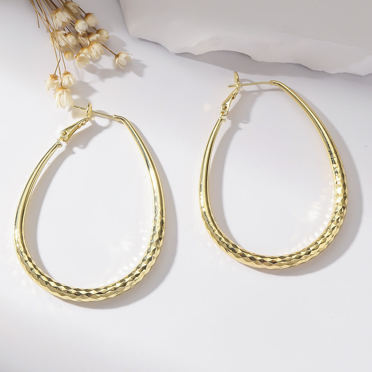 Radiant Teardrop Hoop Earrings in Polished Gold